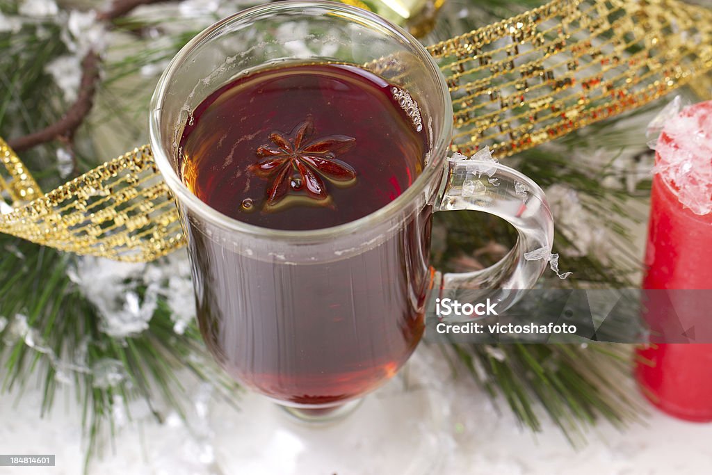 Christmas mug with tea decorated Christmas mug with tea decorated  with red and green snowflakes pine and fir cone ornament Anise Stock Photo