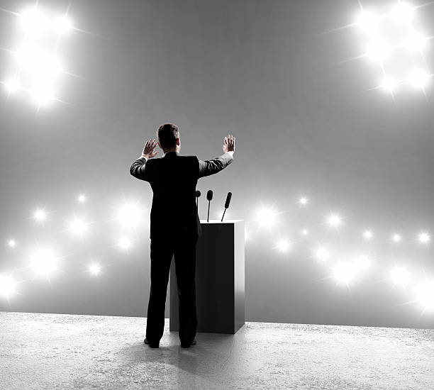 istock businessman standing on podium 184818517