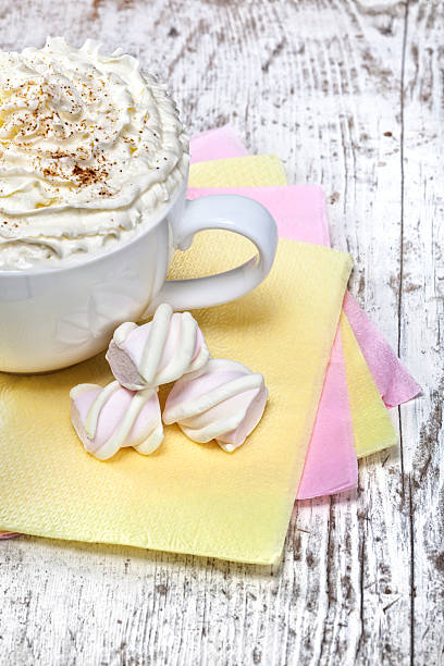 istock hot chocolate with marshmallows and cream on wooden background 184819249