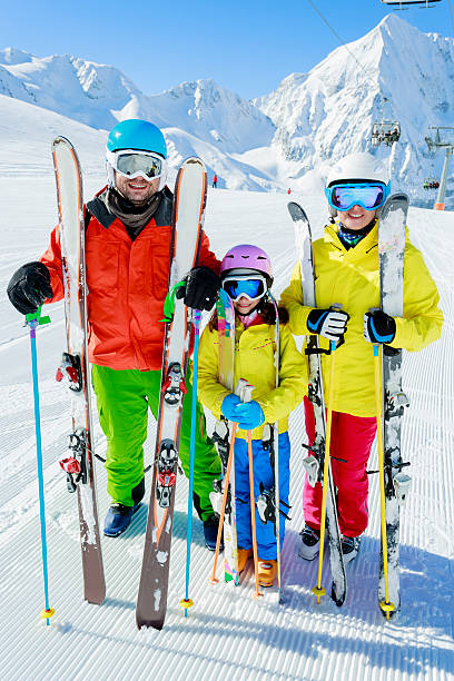 istock Family enjoying winter ski vacation 184819511