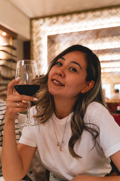 beautiful woman drinks wine