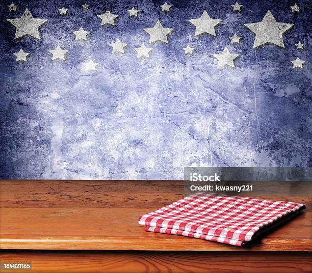 Folded Gingham Cloth On Table With Blue Starred Background Stock Photo - Download Image Now