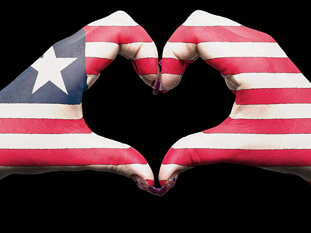 istock Heart and love gesture by hands colored in liberia flag 184821782