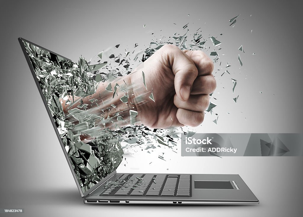 Fist from laptop Fist from laptop. High resolution Laptop Stock Photo