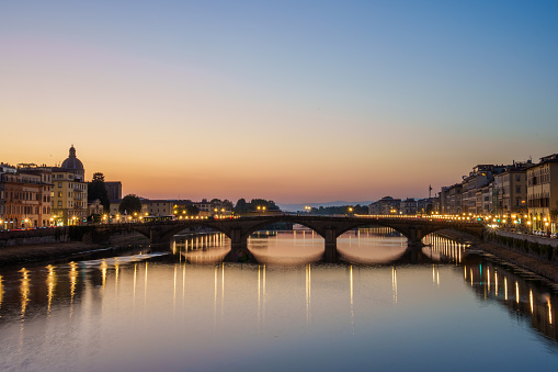 Ponte Santa Trinita Bridge on Arno River in Florence, Tuscany Italy at Dusk Under Clear Skies