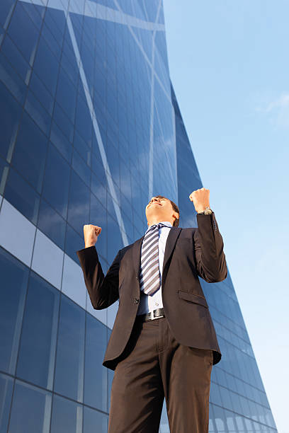 istock Young business man celebrating 184832275