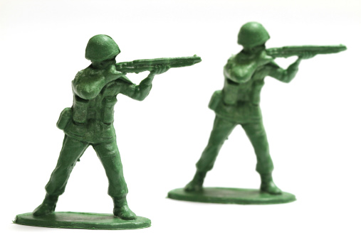 Toy army men on a white background.