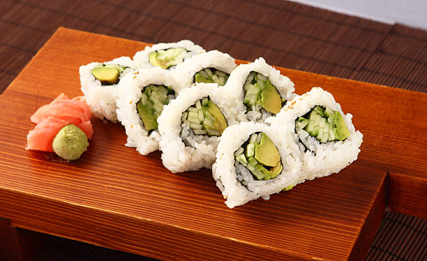 Vegetable Roll "Vegetable Roll - Avocado, Cucumber & Steamed Rice" maki sushi stock pictures, royalty-free photos & images