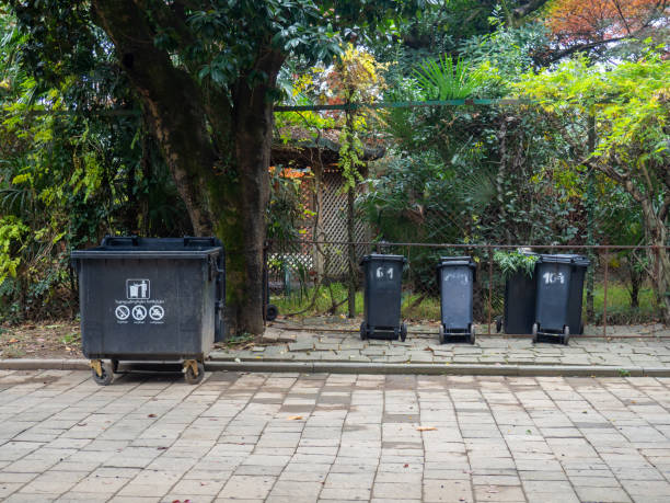 istock Garbage containers in the park. Infrastructure. Caring for the environment. 1848331135