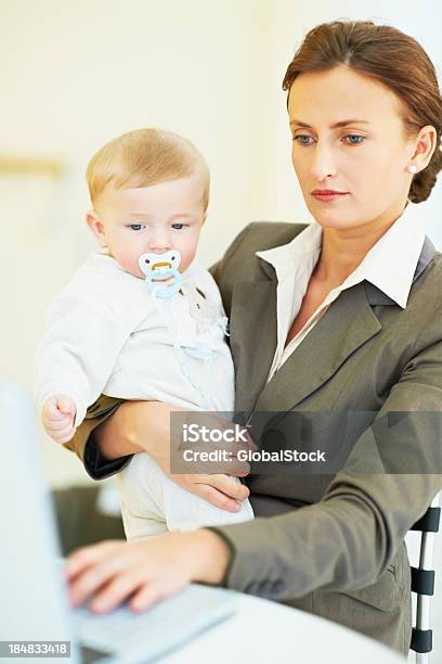 Working Mother Stock Photo - Download Image Now - Adult, Baby - Human Age, Beautiful People