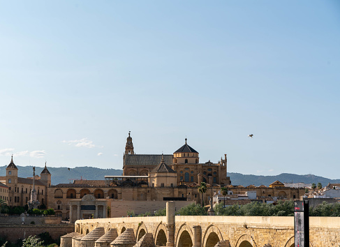 The Roman Bridge across the Guadalquivir river and the Mosque-Cathedral in Cordoba, Spain