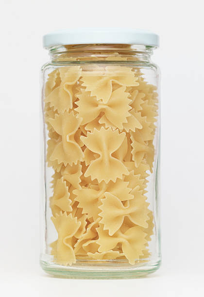 istock Pasta in glass jar on a white background 184833839