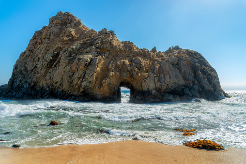 Keyhole Arch at Pfeiffer Beach California landscape in sunny summer day, Big Sur, California.