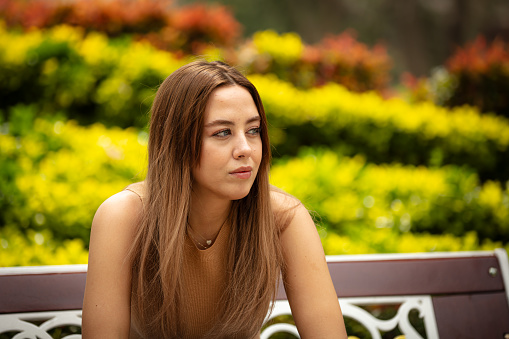 Young woman portrait at public park in springtime.