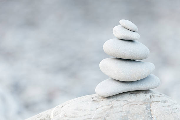 Pile of pebble stones on a beach. Ideal image for relaxation and zen like designs.