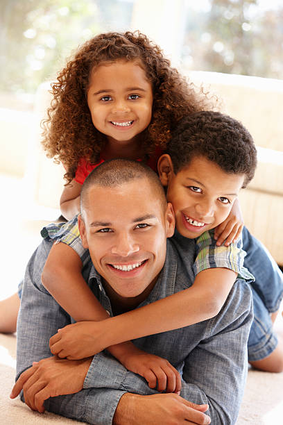 istock Father and children at home 184834283