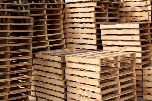 Wood shipping pallets stacked high