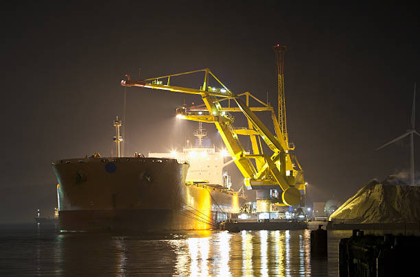 istock Industrial ship being unloaded at night 184834609