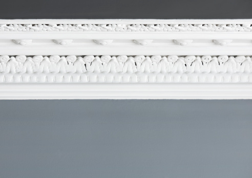 Close up of a freshly painted traditional Georgian cornice moulding on the interior of an Edinburgh flat.