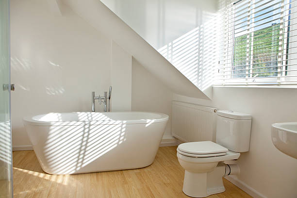 Modern bathroom looking out over a field