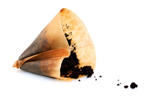 Isolated Used Coffee Filter.