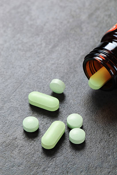 istock Pills pouring out of a bottle 184835114