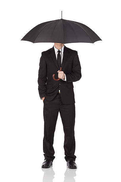 istock Businessman hiding his face with an umbrella 184835744