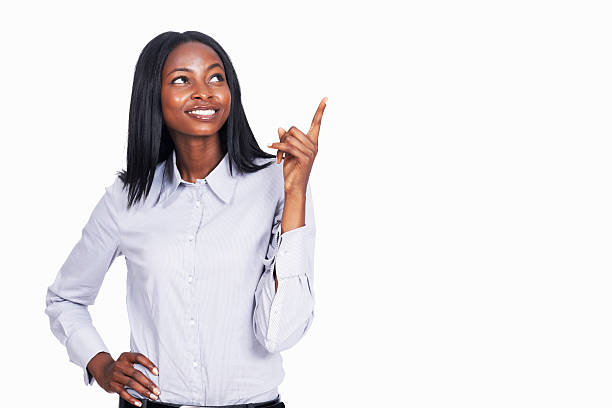 istock Young business woman pointing up 184835851