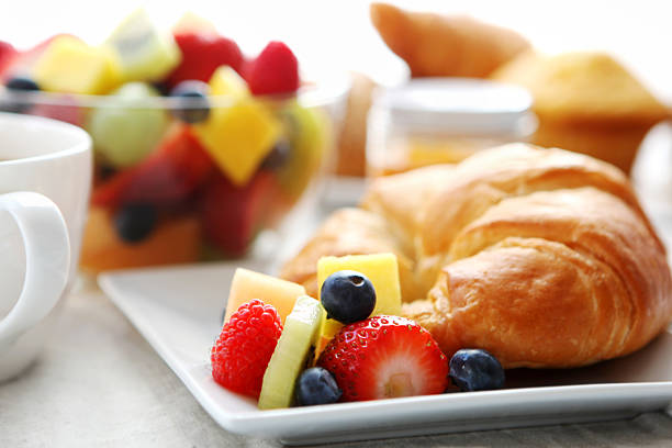 istock breakfast- croissant, fruit salad and coffee 184836004