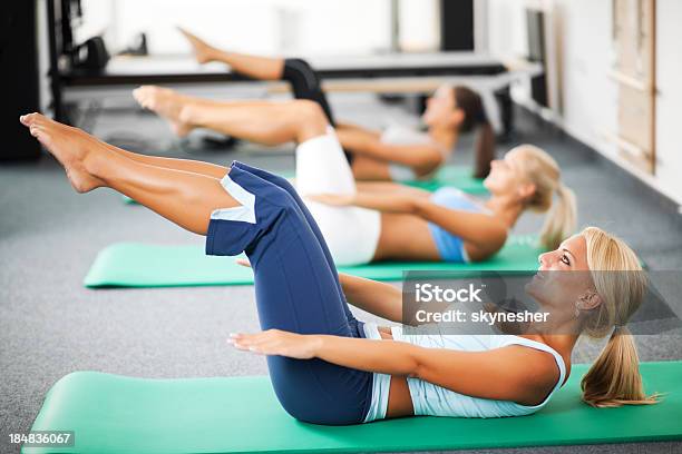 Group Of Women Doing Pilates Exercises Stock Photo - Download Image Now - Abdominal Muscle, Activity, Adult