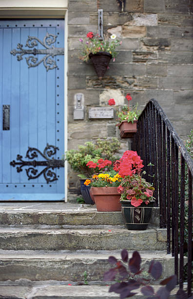 istock Old English architecture in stone - house entrance with steps 184836181