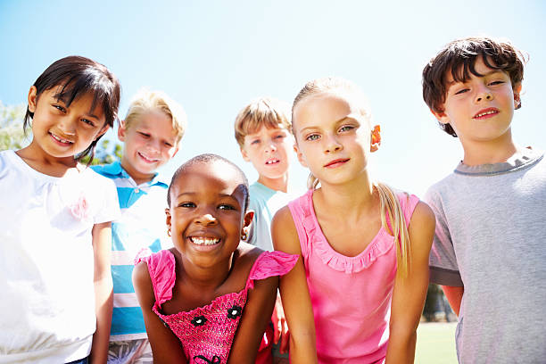 istock Multi ethnic group of children smiling outdoors 184836188