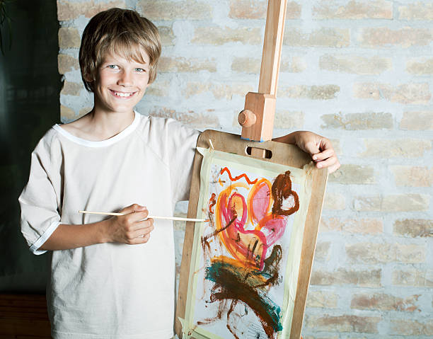 istock Smiling boy with his painting. 184836658