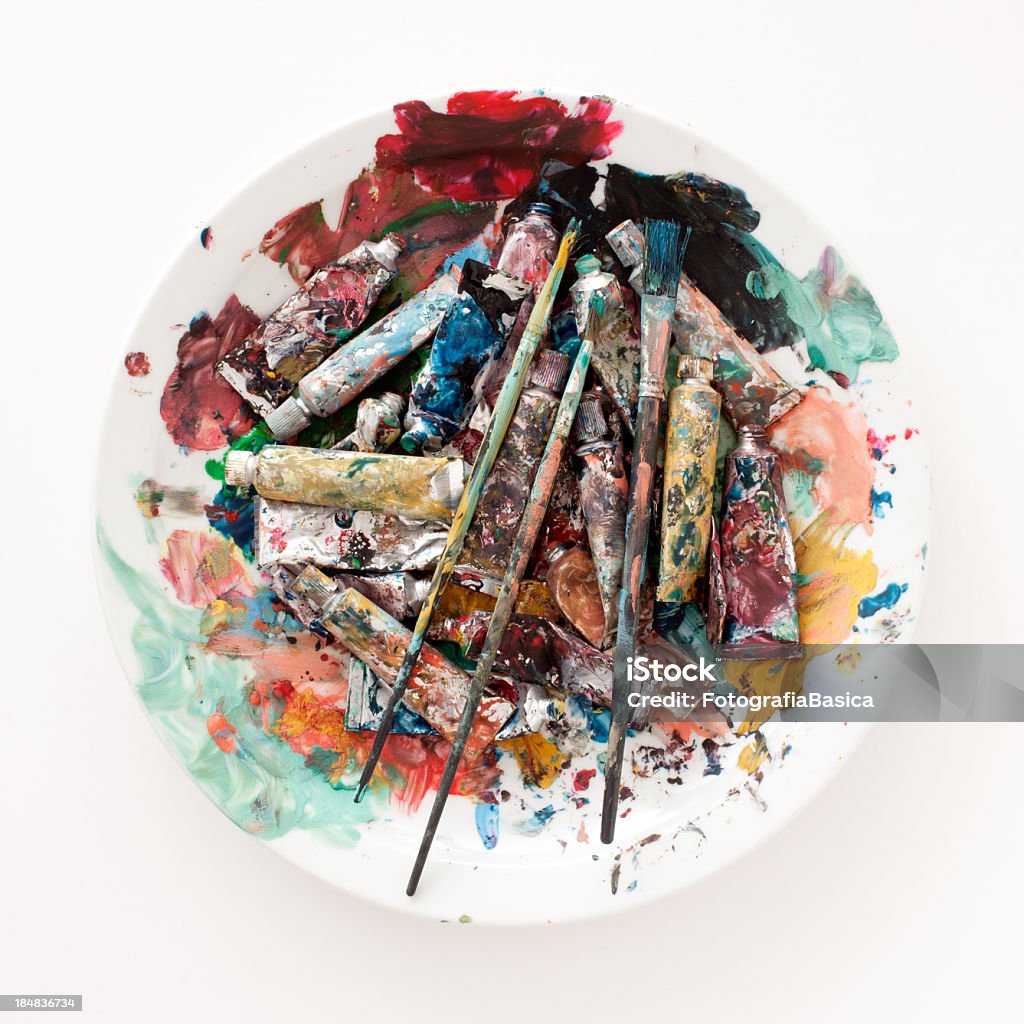 Used gouache paints Top view of dirty dish with pencils and used tubes in it Paint Tube Stock Photo
