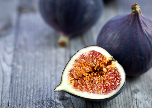 Ripe figs on wooden background