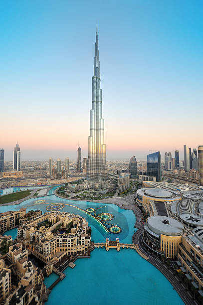 Stunning dubai This is a very rare capture of burj khalifa and downtown dubai city in the first light morning with the fountain lights. dubai stock pictures, royalty-free photos & images