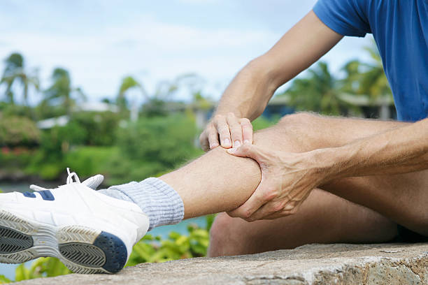 Tibia-syndrome "Typical pain of a jogger in the tibia region, due to an overload of the foot-extending muscles. Also possible: Compartment - Syndrome. XXL size image." shin stock pictures, royalty-free photos & images