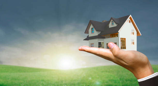 istock House model house concept in  hand 1848378405