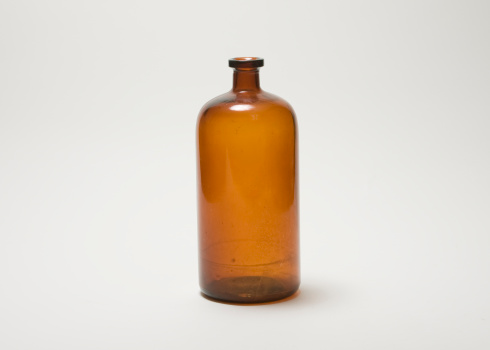 Antique brown glass bottle.