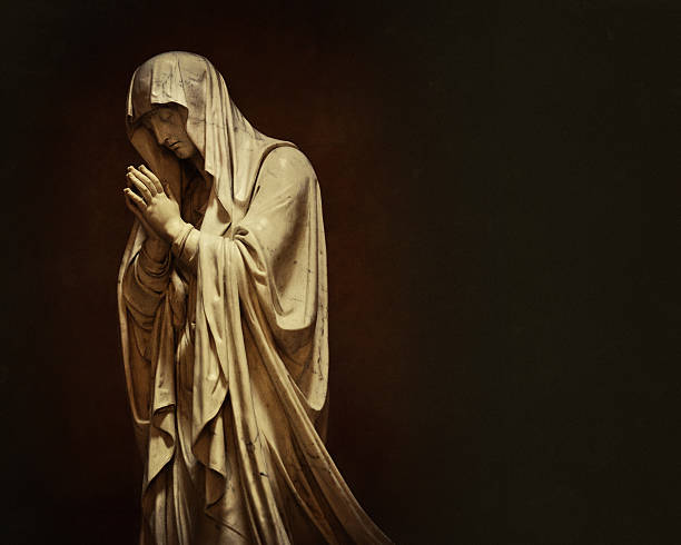 Closeup old weathered white marble statue of praying girl against white background from old cemetery 1877, Sydney Australia, artist unknown, full frame horizontal composition with copy space