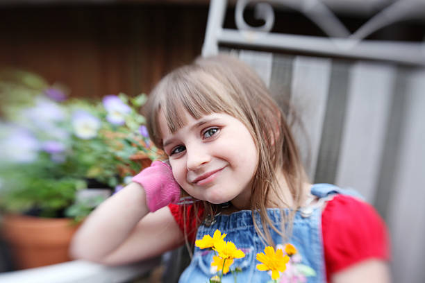 istock Little girl gardening 184838378