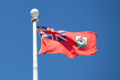 The Bermudian flag against a blue sky. 