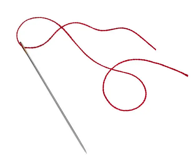 needle with red thread isolated on white