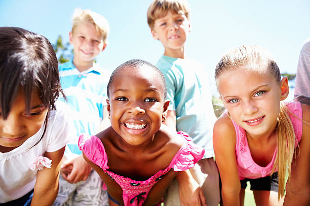 istock Multi ethnic children smiling outdoors 184838711