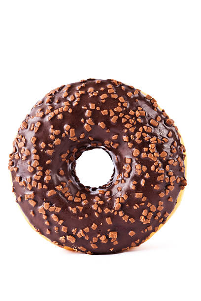 Chocolate covered donut with nuts stock photo