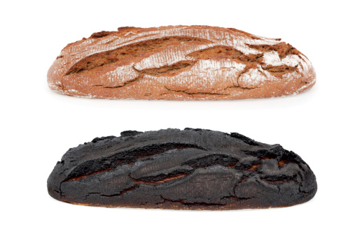 burnt bread and good bread isolated on white background