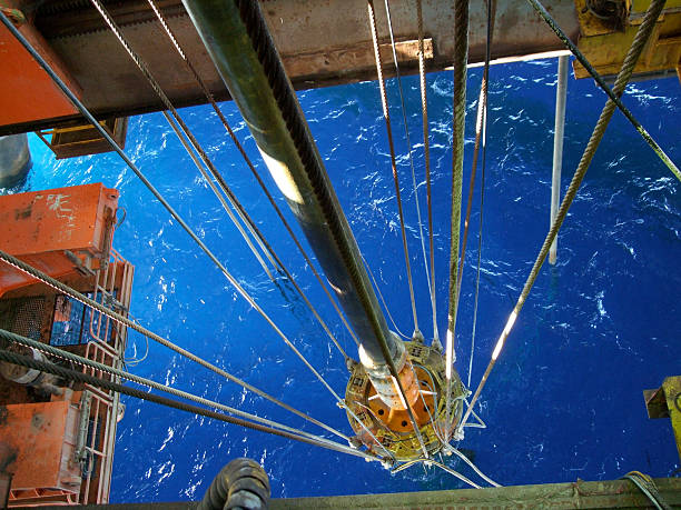 Semisubmersible oil rig moon pool The moonpool and riser of a semisubmersible drilling rig. Large fish visible in waterMore oilfield images: north sea oil and gas stock pictures, royalty-free photos & images