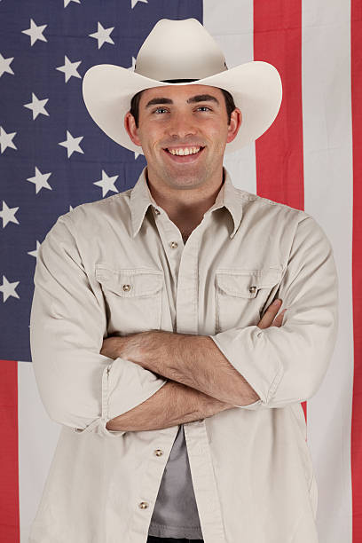 istock Cowboy standing in front of American flag 184840069