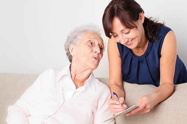 istock Senior woman and caregiver 184840447