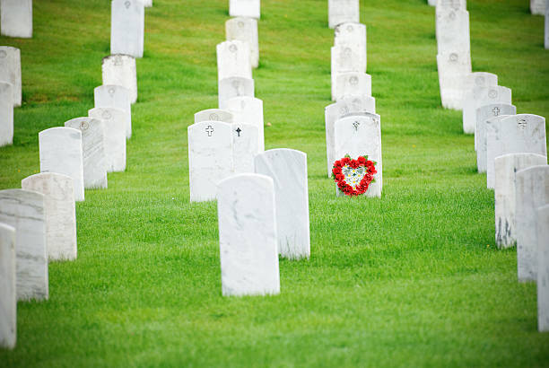 istock flowers at tombstone 184840697